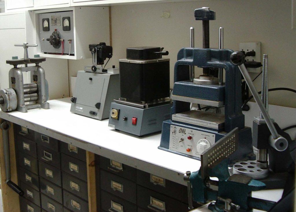 four jewellery repair machines sitting on countertop