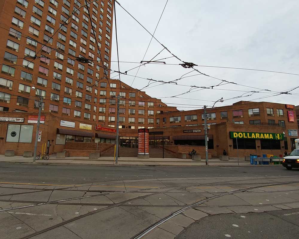 an exterior photo of a red brick high rise building